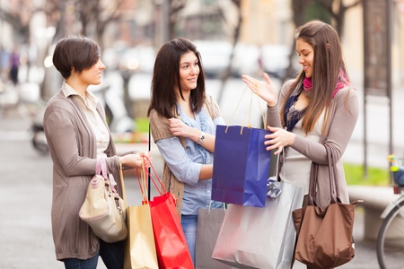 Three Beautiful Young Women with Shopping Bagsの写真素材