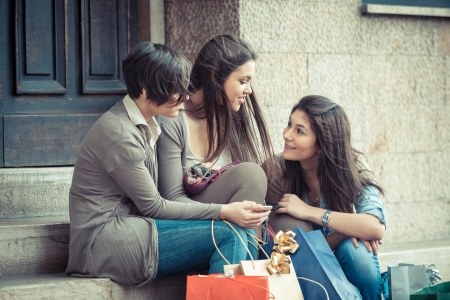 Group of Women Sending Message with Mobile Phoneの写真素材