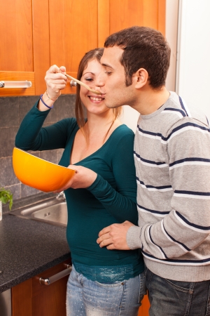 Woman Giving Her Husband a Tasteの写真素材