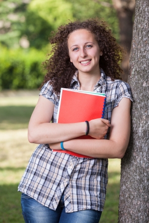 Young Beautiful Female Student at Parkの写真素材