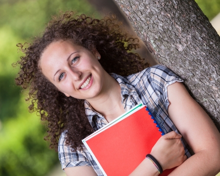 Young Beautiful Female Student at Parkの写真素材