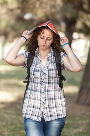Sad Female Student at Parkの写真素材
