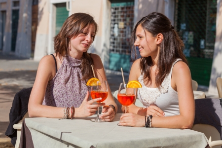 Two Young Women with a Cold Drinkの写真素材