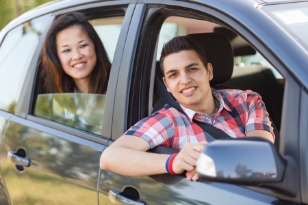 Boy and Girl in a Car Leaving for Vacationの写真素材