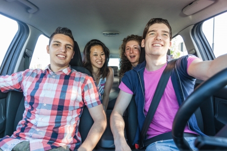 Four Friends in a Car Leaving For Vacationの写真素材