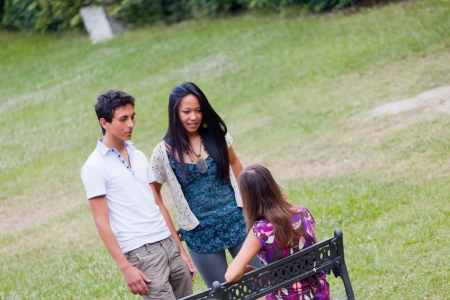 Group of Teenagers Talking at Parkの写真素材