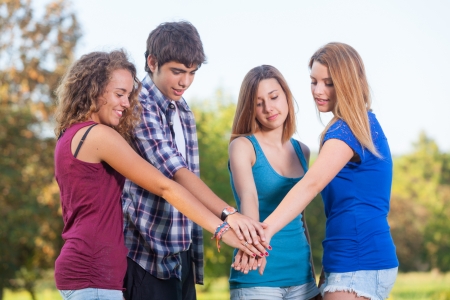 Group of Teenagers with Hands on Stackの写真素材