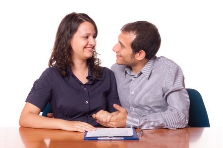 Happy Young Couple with Important Document to Signの写真素材