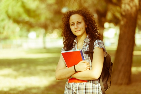 Young Beautiful Female Student at Parkの写真素材