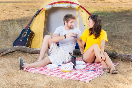 Young Couple Camping and Cheeringの写真素材