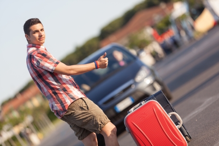 Young Man Hitchhikingの写真素材