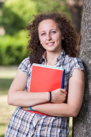 Young Beautiful Female Student at Parkの写真素材
