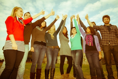College Students with Thumbs Upの写真素材