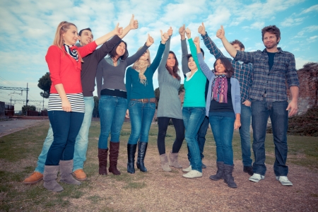 College Students with Thumbs Upの写真素材