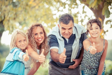 Happy Family with Thumbs Upの写真素材