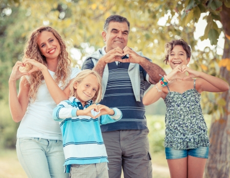 Happy Family with Heart Shaped Handsの写真素材