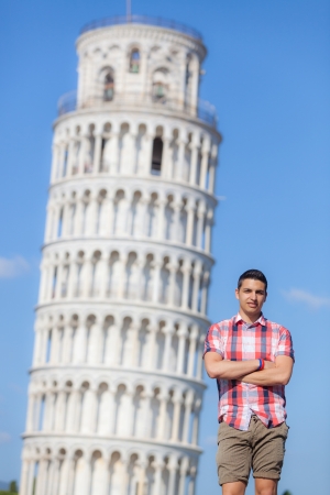 Young Boy Posing with Leaning Tower in Pisaの写真素材