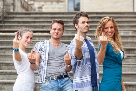 Group of Friends showing Obscene Gestureの写真素材