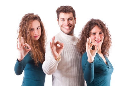 Three Happy Friends Showing Ok Signの写真素材