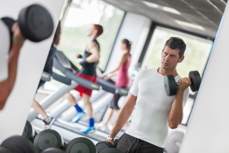 Man Lifting Weights at Gymの写真素材