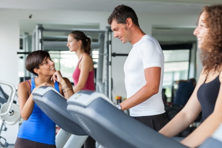 People Running on Treadmill in the Gymの写真素材