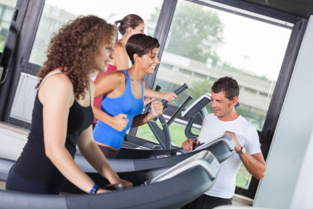 People Running on Treadmill in the Gymの写真素材