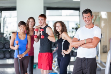 Group of People at Gym with Instructorの写真素材