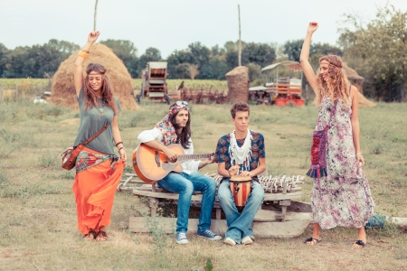 Hippie Group Playing Music and Dancing Outsideの写真素材