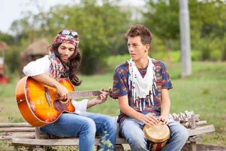 Hippie Group Playing Music and Dancing Outsideの写真素材