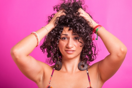 Young Woman with Curly Hairsの写真素材