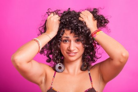 Young Woman with Curly Hairsの写真素材