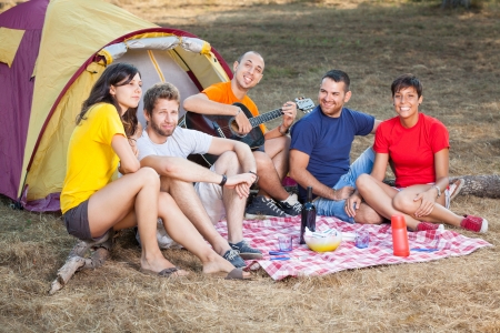 Group of People Camping and Singingの写真素材