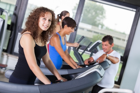 People Running on Treadmill in the Gymの写真素材