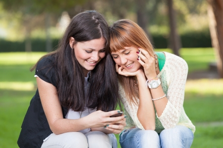 Two Young Women with Mobile Phoneの写真素材