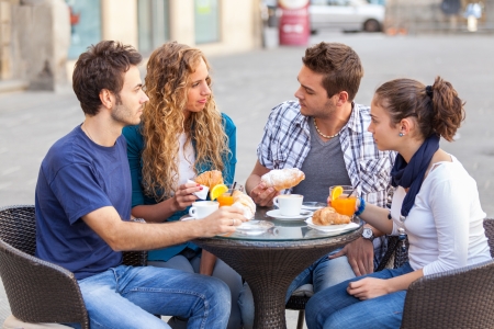 Group of Friends Having a Traditional Italian Breakfastの写真素材