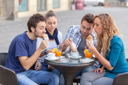 Group of Friends Having a Traditional Italian Breakfastの写真素材