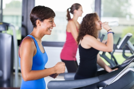 People Running on Treadmill in the Gymの写真素材