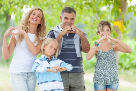 Happy Family with Heart Shaped Handsの写真素材