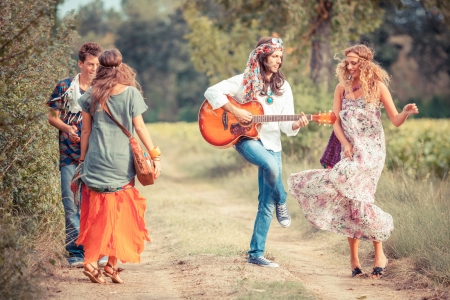 Hippie Group Playing Music and Dancing Outsideの写真素材