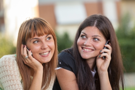 Two Young Women with Mobile Phoneの写真素材
