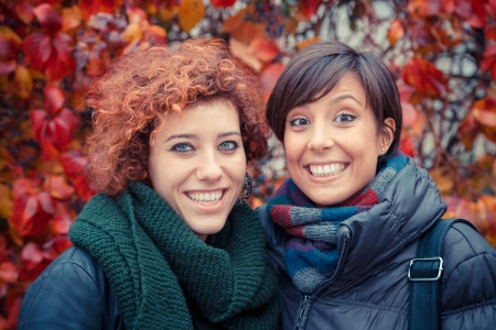 Two Beautiful Young Women Outside on Autumnの写真素材