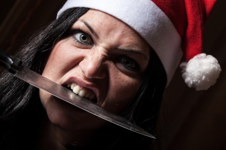 Bad Woman with Santa Hat and Knifeの写真素材