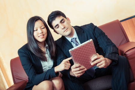 Young Business Couple on the Sofaの写真素材