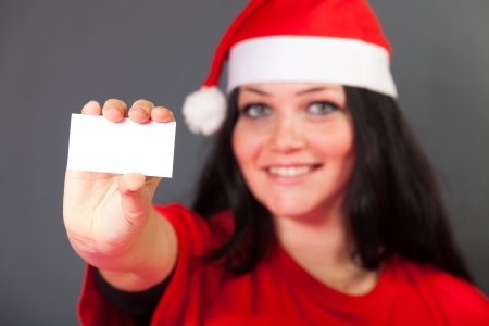 Cheerful Woman with Santa Hatの写真素材