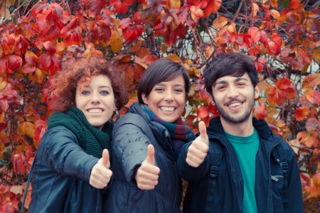 Happy Friends with Thumbs Upの写真素材