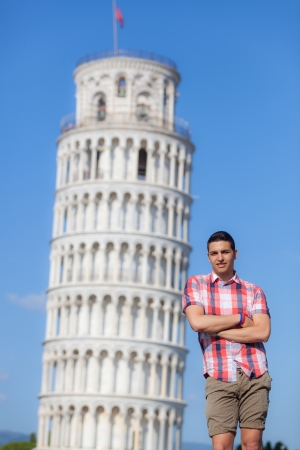 Young Boy Posing with Leaning Tower in Pisaの写真素材