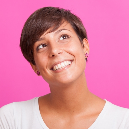Beautiful Young Woman Portrait on Fuchsia Backgroundの写真素材
