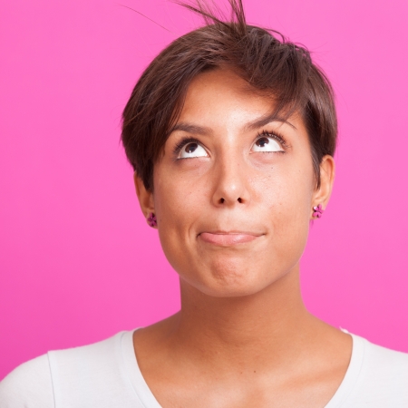 Beautiful Young Woman Portrait on Fuchsia Backgroundの写真素材
