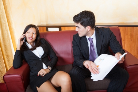 Young Business Couple on the Sofaの写真素材