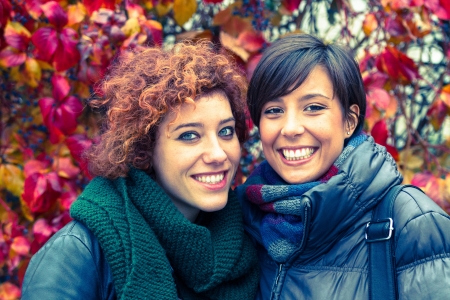 Two Beautiful Young Women Outside on Autumnの写真素材